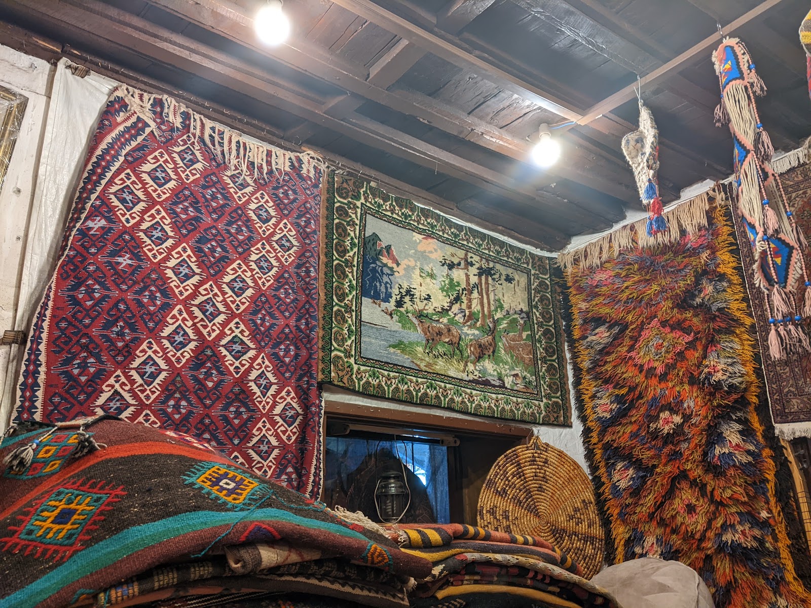 Kilim rugs hanging inside the shop